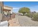 Spacious backyard features a patio, built-in grill, mature trees, and low-maintenance landscaping at 2608 Saltbush Dr, Las Vegas, NV 89134