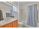 Bright bathroom features a shower/tub combo, vanity sink, a window and neutral wall color at 2608 Saltbush Dr, Las Vegas, NV 89134