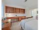 Bedroom boasts custom built-ins, a large desk area, neutral color palette, and access to ensuite at 2608 Saltbush Dr, Las Vegas, NV 89134