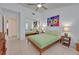 Bright and airy bedroom with tile floors, natural light, and ample closet space at 2608 Saltbush Dr, Las Vegas, NV 89134