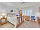 Sunlit bedroom featuring neutral walls, tile flooring, and a classic wood bed frame with cozy furnishings at 2608 Saltbush Dr, Las Vegas, NV 89134