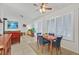Open dining area with shutters, tile flooring, and connection to the living room at 2608 Saltbush Dr, Las Vegas, NV 89134