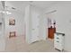 The hallway features tile flooring, white walls, and doorways to other rooms at 2608 Saltbush Dr, Las Vegas, NV 89134