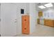 Open kitchen area with tile flooring, wooden cabinets, and white appliances at 2608 Saltbush Dr, Las Vegas, NV 89134