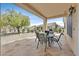 Covered patio with stone flooring and outdoor seating, perfect for entertaining and enjoying the outdoors at 2608 Saltbush Dr, Las Vegas, NV 89134