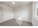 Bedroom with carpeting features natural lighting coming in through the window at 2621 Bello Dr, North Las Vegas, NV 89030