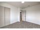 Bedroom featuring sliding closet doors, lighting and comfortable carpeting at 2621 Bello Dr, North Las Vegas, NV 89030