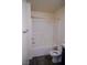 Bathroom featuring a shower over tub and toilet with granite countertops and dark wood cabinets visible at 2765 Frosted Teal Ave, North Las Vegas, NV 89086