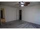 Bedroom featuring neutral carpet, fan, baseboards, and ensuite bathroom at 2765 Frosted Teal Ave, North Las Vegas, NV 89086