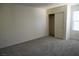 Bedroom features plush carpet, closet with sliding doors, and a bright window at 2765 Frosted Teal Ave, North Las Vegas, NV 89086