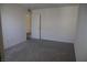 Bedroom featuring gray carpeting and a doorway to another room at 2765 Frosted Teal Ave, North Las Vegas, NV 89086