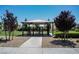 Community dog park featuring a shaded enclosure, gravel ground, and walking paths lined with trees at 2765 Frosted Teal Ave, North Las Vegas, NV 89086