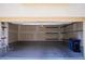 Spacious garage featuring concrete flooring and built-in shelving for optimal storage solutions and organization at 2765 Frosted Teal Ave, North Las Vegas, NV 89086