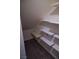 Hall closet with wood-look flooring and built-in shelving for organization at 2765 Frosted Teal Ave, North Las Vegas, NV 89086