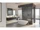 Contemporary bathroom featuring a freestanding tub and a luxurious walk-in shower at 3 Climbing Canyon Dr, Henderson, NV 89052
