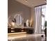 Spa-like bathroom with dual vanities, sleek fixtures, and a luxurious soaking tub at 3 Climbing Canyon Dr, Henderson, NV 89052