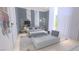 Light-filled bedroom featuring contemporary decor, bed, and seating area at 3 Climbing Canyon Dr, Henderson, NV 89052