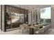 Bright dining room boasts modern chandelier, sleek wine racks, and stylish table setting at 3 Climbing Canyon Dr, Henderson, NV 89052