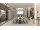 Bright dining room features sleek wine storage, custom chandelier, and seating for 12 at 3 Climbing Canyon Dr, Henderson, NV 89052