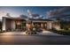 Modern home with a sleek design, featuring a well-manicured lawn and stylish driveway, showcasing contemporary elegance at 3 Climbing Canyon Dr, Henderson, NV 89052