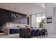 Modern kitchen featuring designer lighting, marble countertops, and ample cabinet space at 3 Climbing Canyon Dr, Henderson, NV 89052