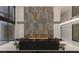 Stunning living room has an ornate fireplace, high ceiling, and elegant decor for a sophisticated and inviting atmosphere at 3 Climbing Canyon Dr, Henderson, NV 89052