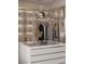 Well-organized walk-in closet featuring custom shelving and elegant chandelier lighting at 3 Climbing Canyon Dr, Henderson, NV 89052