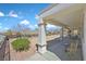 Spacious covered patio includes views of the landscaped backyard with comfortable seating arrangements at 3042 Lake Barkley Rd, Henderson, NV 89052