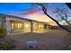 Large backyard with covered patio overlooking the landscaped yard and city views at 3042 Lake Barkley Rd, Henderson, NV 89052