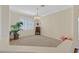 Comfortable bonus room with plush carpeting and stylish chandelier at 3042 Lake Barkley Rd, Henderson, NV 89052