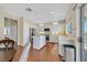 Bright kitchen featuring white cabinets, stainless steel appliances, and a central island at 3042 Lake Barkley Rd, Henderson, NV 89052