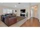 Bright living room with large windows, comfortable seating, and a ceiling fan at 3042 Lake Barkley Rd, Henderson, NV 89052