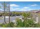 Landscaped street view with mature trees and shrubs enhances the curb appeal of this home in Nevada at 3042 Lake Barkley Rd, Henderson, NV 89052