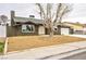 Charming single-story house with desert landscaping, a tree, and a two-car garage at 3119 Desmond Ave, Las Vegas, NV 89121