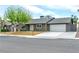 Charming single-story home with mature shade tree, two-car garage, and well-maintained landscaping at 3119 Desmond Ave, Las Vegas, NV 89121