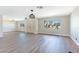 Spacious living room with new flooring, modern lighting, and large windows at 3119 Desmond Ave, Las Vegas, NV 89121