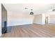 Large living room features light wood flooring, a black-tiled fireplace, and an open layout at 3119 Desmond Ave, Las Vegas, NV 89121