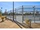 View of the community tennis courts with a high fence and secure surroundings at 3119 Desmond Ave, Las Vegas, NV 89121