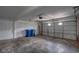 An empty two car garage with painted walls, concrete floors, and a metal ladder at 3319 Royce Ct, Las Vegas, NV 89121