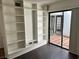 Bedroom area with built-in shelving and sliding door access to an enclosed patio at 3422 Pino Cir, Las Vegas, NV 89121