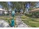 Dog park with waste station and mature trees in a green lawn area at 3422 Pino Cir, Las Vegas, NV 89121