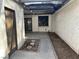 A cozy enclosed patio area with a covered pergola, concrete pavers and a side door at 3422 Pino Cir, Las Vegas, NV 89121