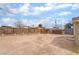 Wide angle view of the backyard with a fence at 3704 Haddock Ave, North Las Vegas, NV 89030