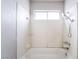 Bathroom featuring a tub with shower and updated fixtures at 3704 Haddock Ave, North Las Vegas, NV 89030