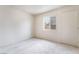 Bright bedroom with plush carpet, window with security bars and closet at 3704 Haddock Ave, North Las Vegas, NV 89030