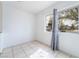 Bright bedroom with tile floors and a sunlit window at 3704 Haddock Ave, North Las Vegas, NV 89030