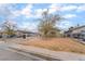 Modest single story home with front yard and car parking spaces at 3704 Haddock Ave, North Las Vegas, NV 89030