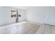 Inviting living room with tile floors, white walls, and natural light, ready for your personal touch at 3704 Haddock Ave, North Las Vegas, NV 89030