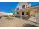 The covered patio and landscaped yard provide a relaxing outdoor living space at 371 Sanctuary Ct, Henderson, NV 89014