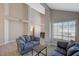 Bright living room with wood-look flooring, natural light, and neutral paint at 371 Sanctuary Ct, Henderson, NV 89014